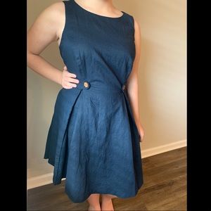 Navy fit and flare dress with wood flower buttons